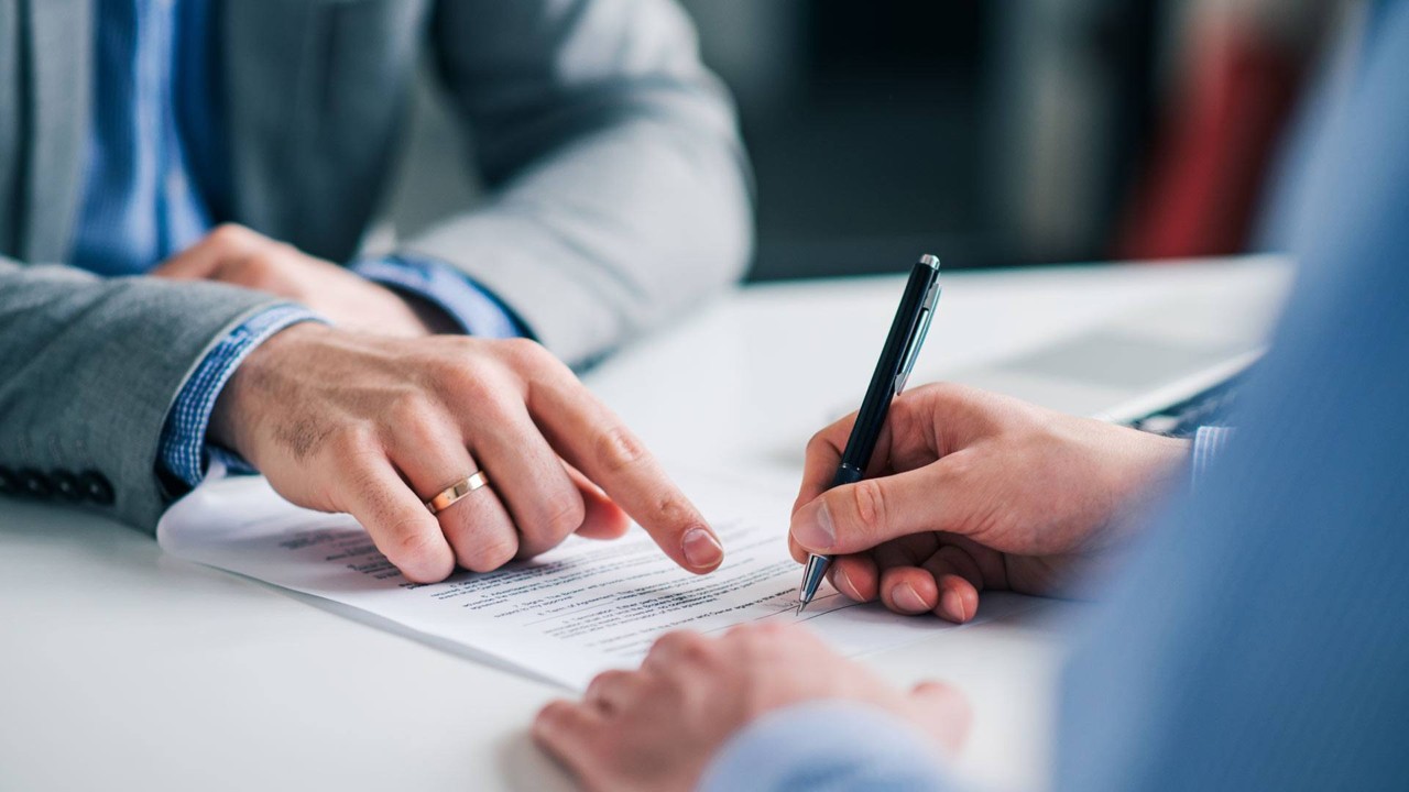 hand signing paper 